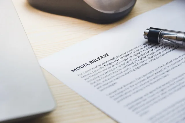 paper, model release, form, document, signing, pen, desk, agreement, business, contract, signature. How to score UK talent agencies with public evidence and a transparent rubric