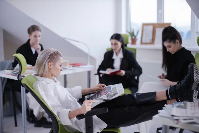 Women professionals reading and focusing in a modern and stylish office environment. What a talent agencies ninety day plan means for England rosters