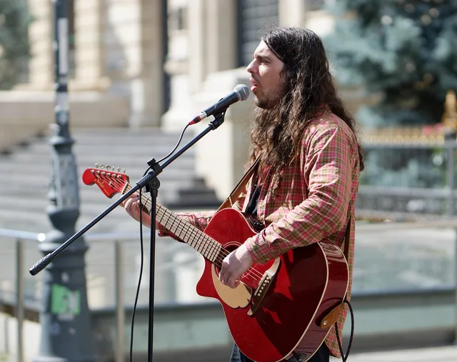 staff, busker, boy, long hair, playing, guitar, voice, microphone, public place, street, urban, musical, talent. When to run a talent agencies selection checklist before you sign