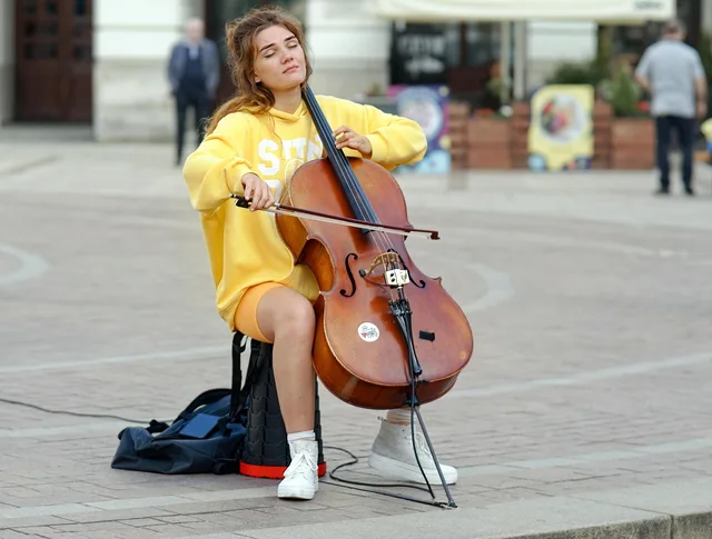 woman, young, cello, playing, public place, square, old town, musical, talent, lifestyle. What a talent agencies supplier comparison means for English firms